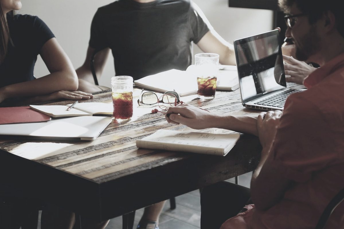 Counsel reviewing documents together at a table